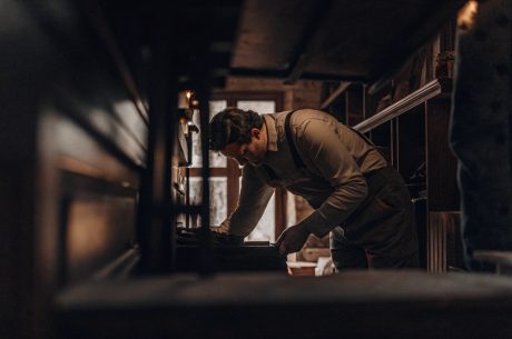 Professional performing hoarding cleanup services inside a residential property