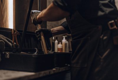 Technician using protective gear while handling equipment, showing professional mold services compared to DIY mold removal methods