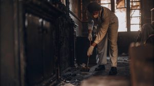 Technician cleaning soot during fire damage restoration in McLean VA
