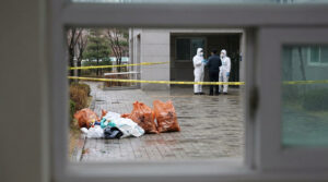 Biohazard cleanup team securing a contaminated scene