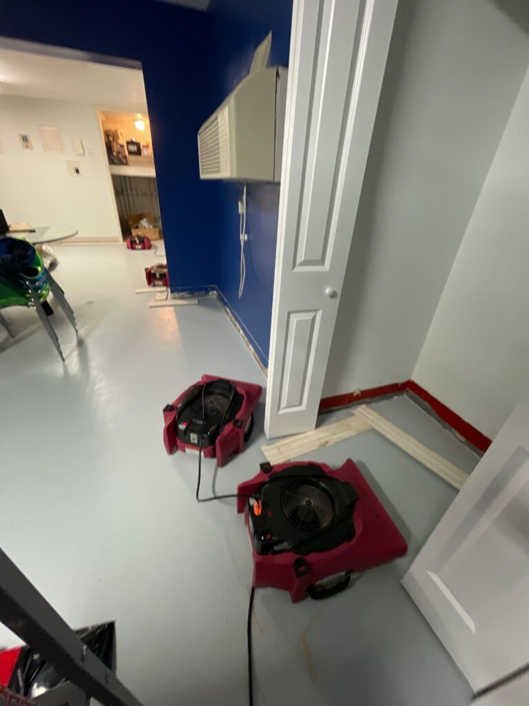 Drying the water in the flooded basement.