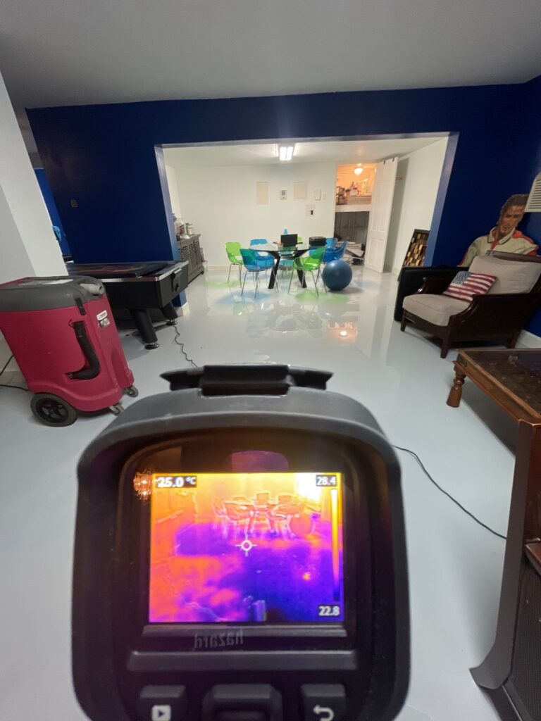 Checking for water in the flooded basement.