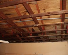 Wood ceiling before water damage remediation