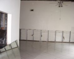 Wall damaged before water damage remediation by PuroClean of South Miami Miami FL