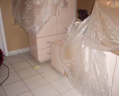 Covered furniture in the fire damage remediation by PuroClean of South Miami Miami FL