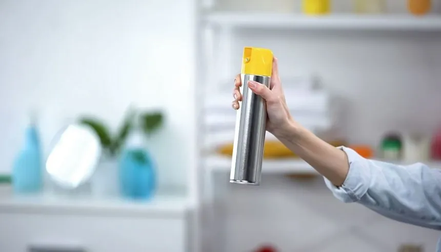 odor control | a person spraying fibreeze