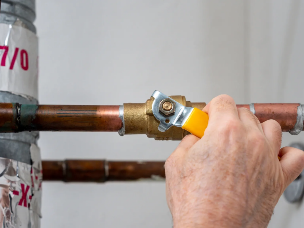 Shutting off the main water valve is the first step in a burst pipe emergency.