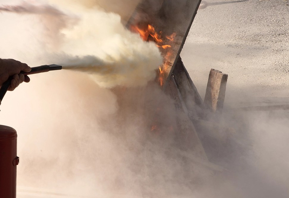 The powder inside most portable fire extinguishers is known as a dry chemical extinguishing agent. Its purpose is to interrupt the chemical reaction that allows a fire to continue burning while separating the fuel source from oxygen.