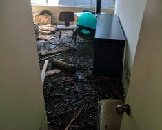 Doorview of dirt covered room by PuroClean of Naples