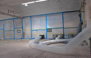 Commercial space with plastic containment walls, air ducts, and equipment