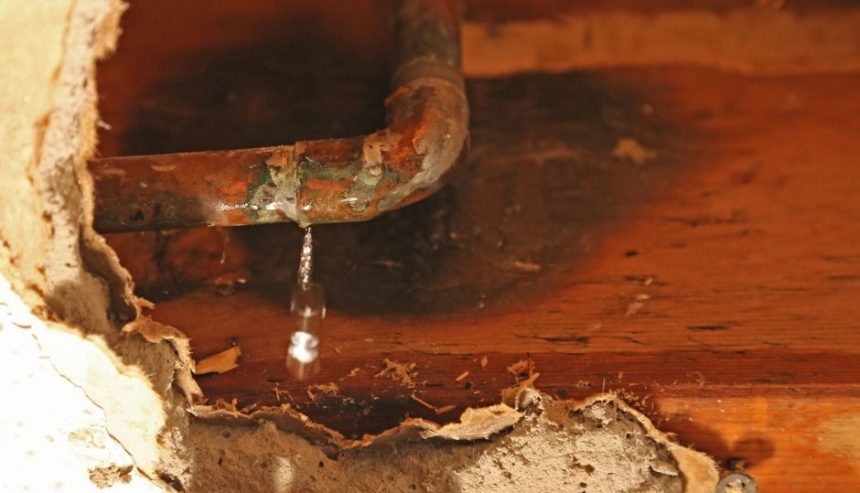 water damage in multi-unit buildings can start with a corroded pipe like this one leaking behind walls, under floors or above ceilings