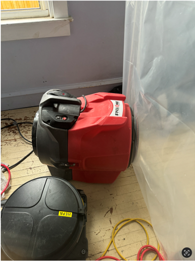 Once the contaminated area was contained, a HEPA air scrubber and HEPA vacuum were used to rid any microbial spores.