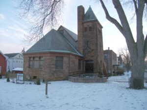 Bethany Presbyterian Church, a stone building with a steeple, stands in a snowy winter