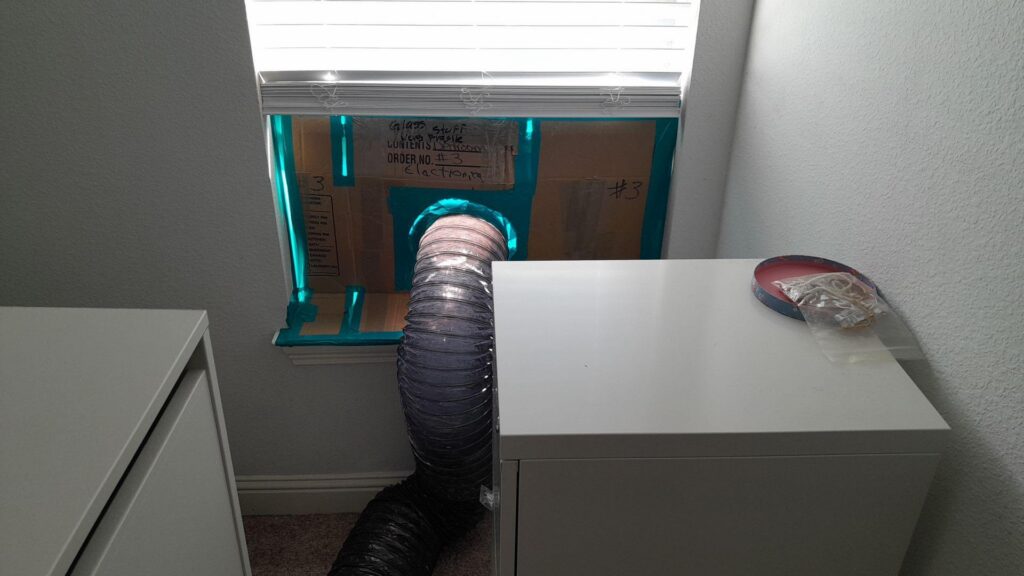 A HEPA vacuum hose leads outside. 