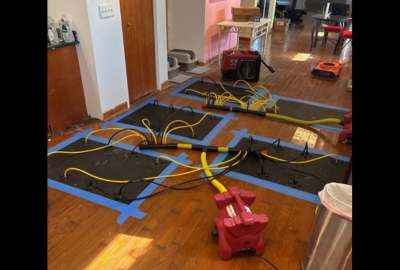 Drying equipment in place as part of a home water damage restoration process, helping remove excess moisture and support proper drying inside a residential space.
