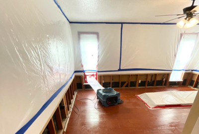 Professional biohazard cleanup in progress at a residential property in Park Cities/North Dallas, with containment barriers and HEPA equipment in use.