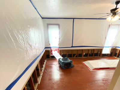 Professional biohazard cleanup in progress at a residential property in Park Cities/North Dallas, with containment barriers and HEPA equipment in use.