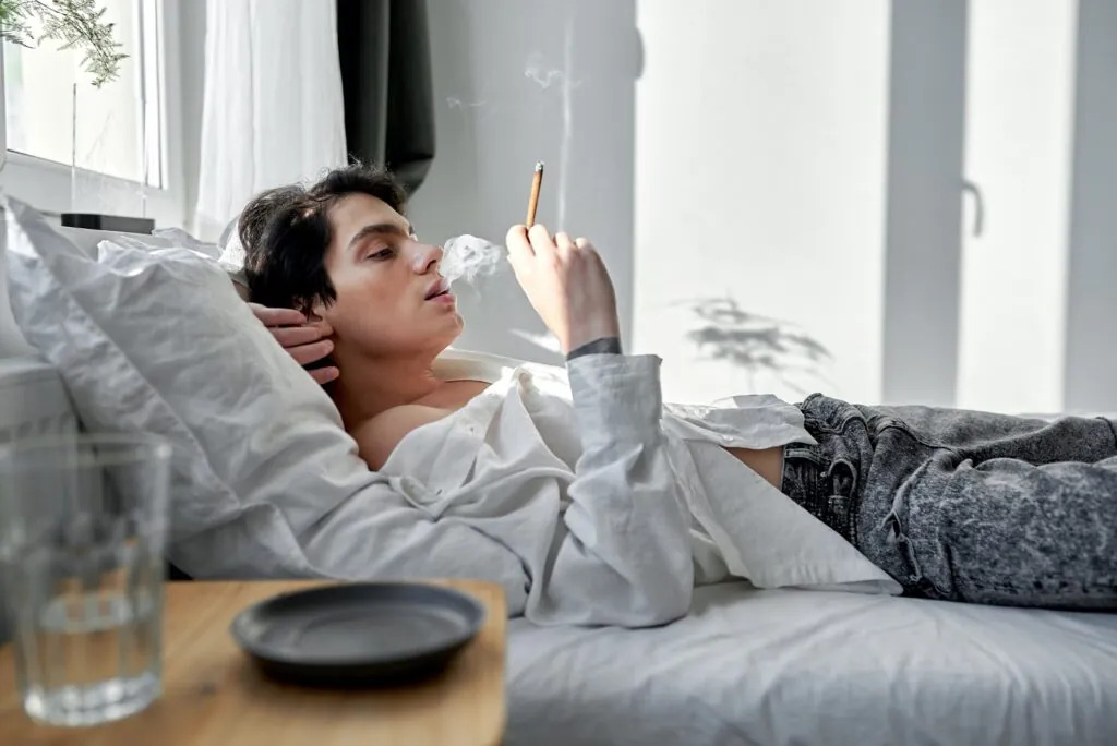 Man Smoking in a room