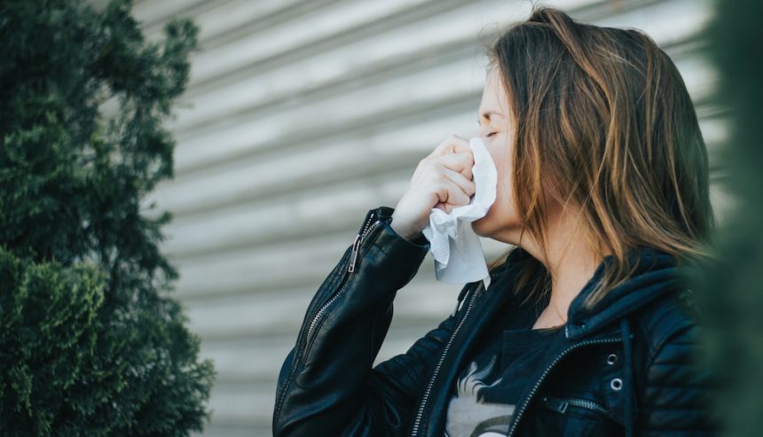 Woman sneezing