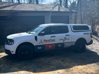 PuroClean service vehicle parked outside a residential property, representing the company’s prompt response and expertise in structural repair services after property damage.
