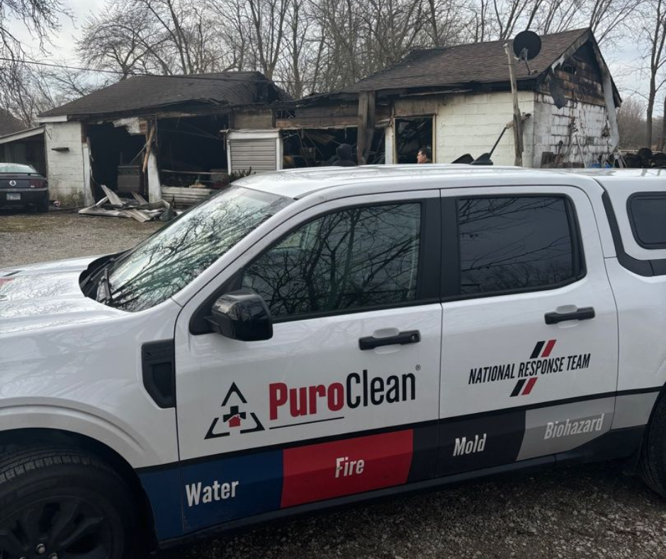 PuroClean vehicle on-site at a severely burned structure, responding to a residential fire and supporting long-term fire resilience in the Orland Park community.