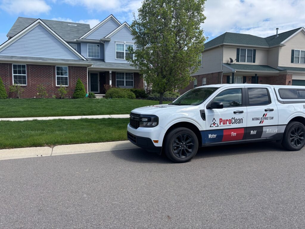 Technician from PuroClean of Orland Park providing fast water damage restoration to prevent mold growth and costly repairs.