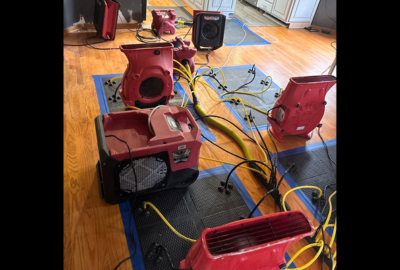 Drying equipment in place as part of a home water damage restoration process, helping remove excess moisture and support proper drying inside a residential space.