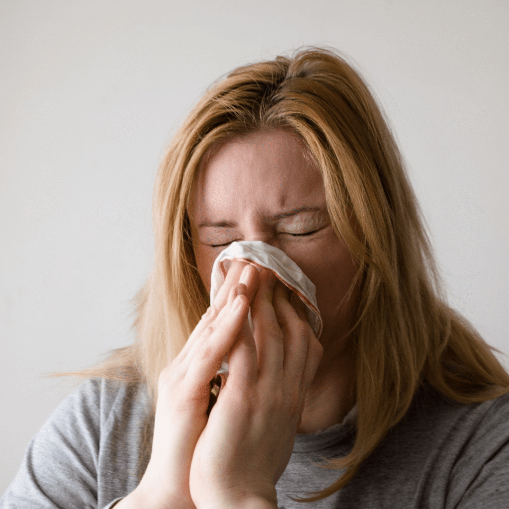 woman sneezing