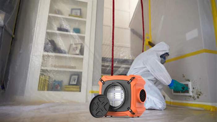 Containment area with HEPA air scrubber running during mold remediation