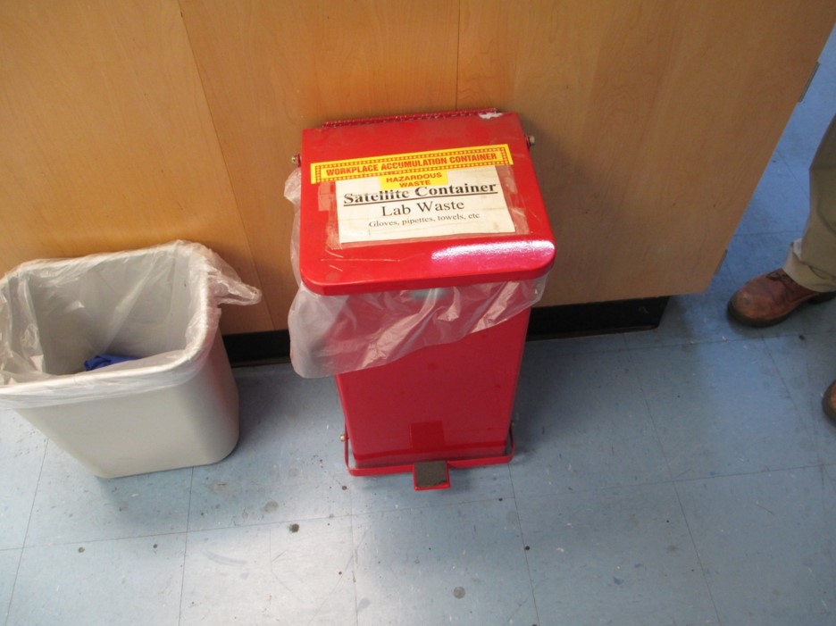 Close-up of hazard disposal containers prepared for proper remova