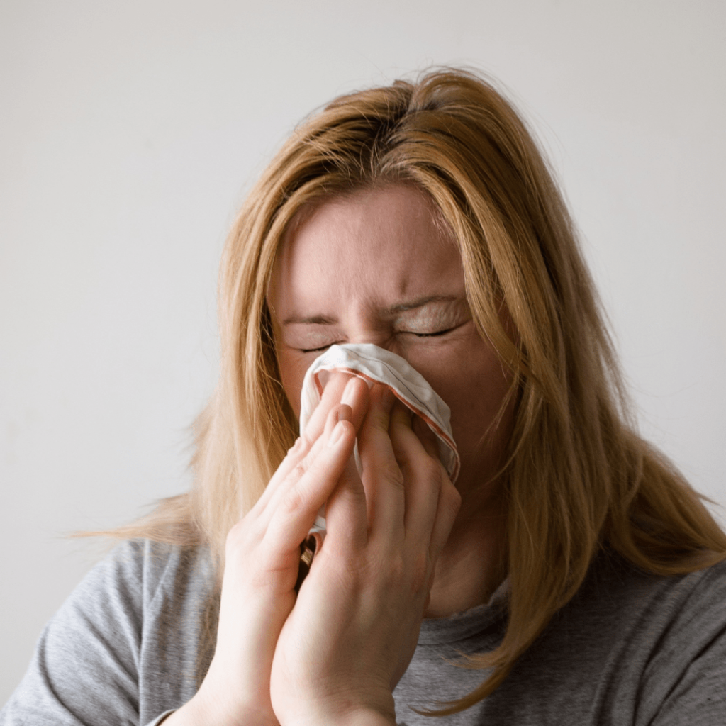 woman sneezing