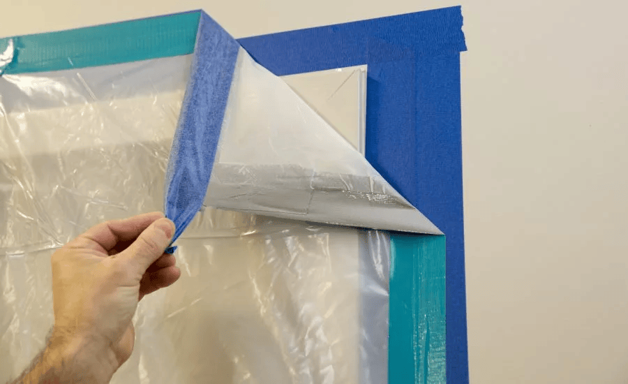 POV shot of a technician sealing a containment barrier with heavy duty tape