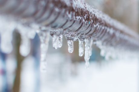 Frozen pipe with icicles on it.