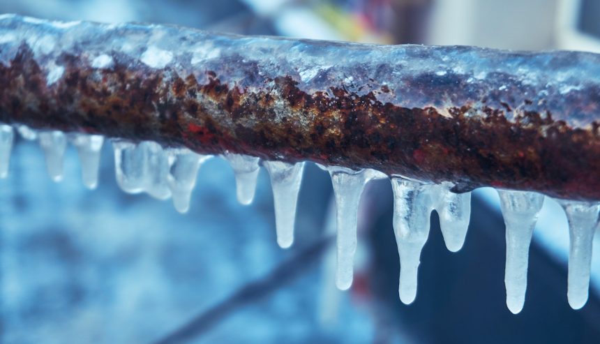 Small pipe with icicles on it.