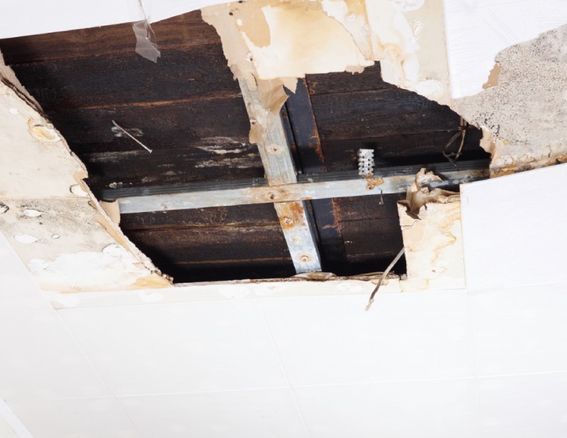 Breaking decaying ceiling after water damage
