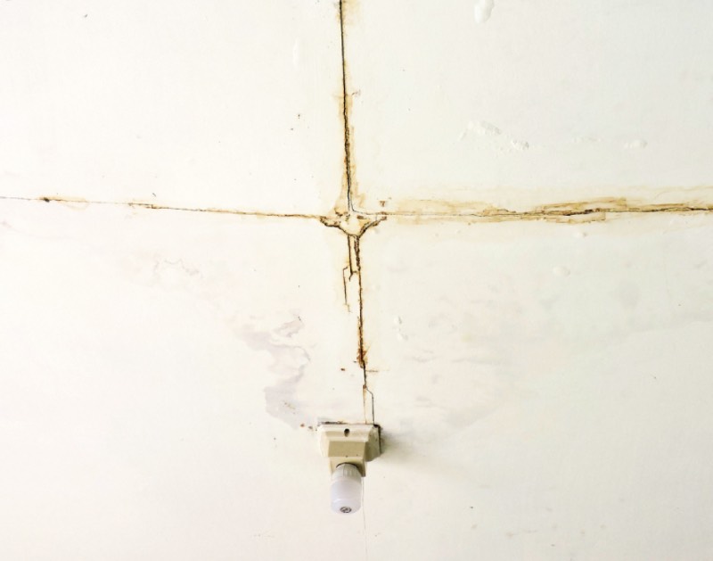 water damage leading to erosion on a ceiling