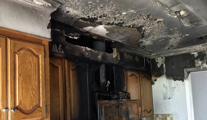 property damage restoration after a fire burnt kitchen cupboards