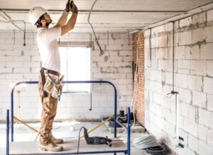 a professional using a moisture meter to assess damage