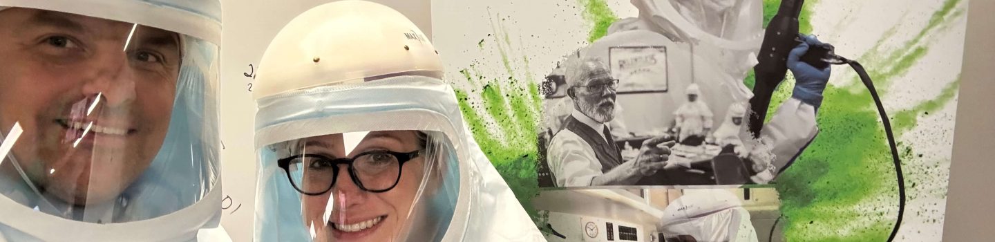 Smiling professional in protective gear providing safe fentanyl Cleanup and Biohazard Restoration services for a clean, healthy home.