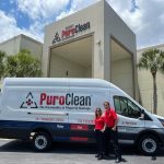 Carlos and Maria beside the puroclean service van fire and water restoration services