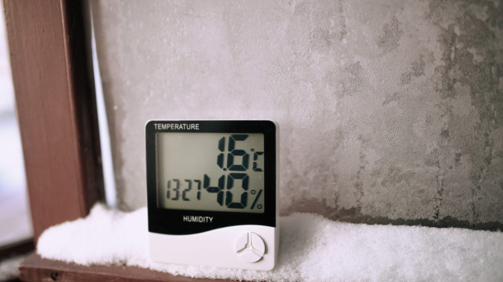 A digital thermometer displays 1.6°C and 40% humidity on. How To Deal With Moisture