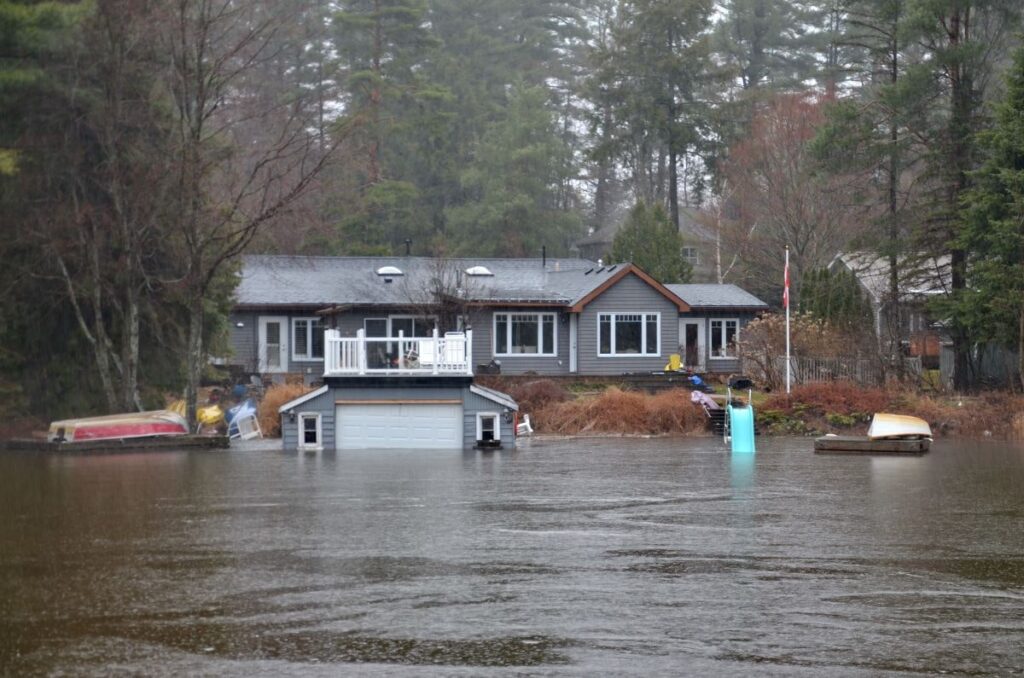 Flooded home. Spring flooding prevention is important during the months between winter and summer. Flood Cleanup