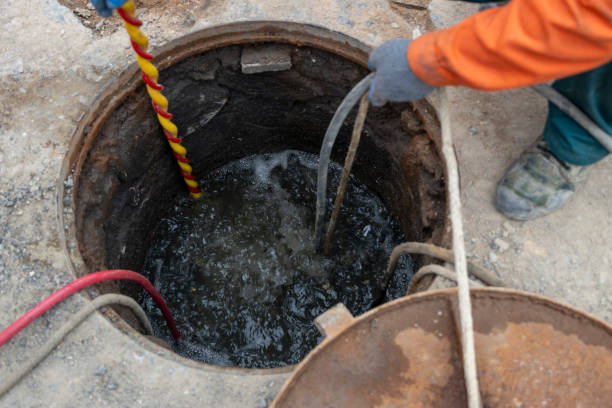 sewage backup in the basement, municipal workers clearing sewer