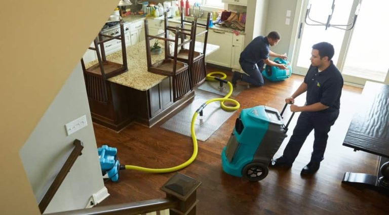 water damage restoration near me certified technicians with drying equipment inside Plantation FL home