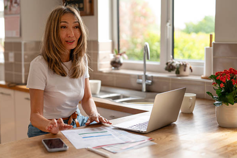  water damage restoration near me homeowner reviewing insurance documents after flood in Plantation FL