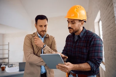 water damage faqs ; PuroClean restoration technician helping Plantation FL homeowner with insurance claim documentation