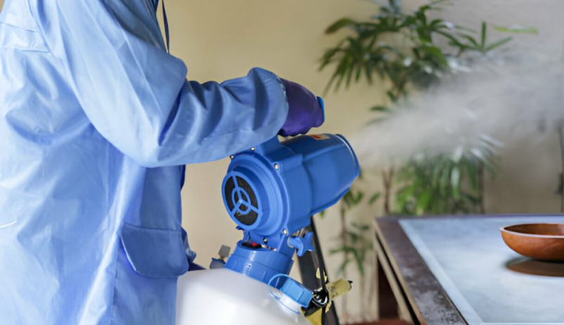 Technician using thermal fogger to remove smoke smell after fire in Plantation FL | How to Remove Smoke Smell After Fire