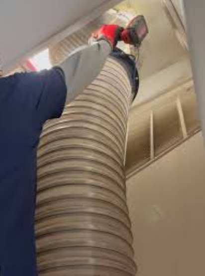professional demonstrating air duct cleaning benefits inside Plantation FL residence