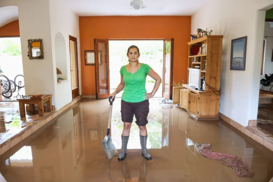 water damage faqs ; flooded living room showing common water damage in a Plantation FL home