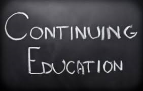 Chalkboard with the words "Continuing Education" written in white chalk.